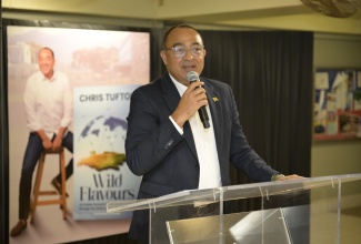 Minister of Health and Wellness, Dr. the Hon. Christopher Tufton, addresses the recent launch of his book, ‘Wild Flavours’, at the University of the West Indies (UWI), Mona Campus, in St. St. Andrew.

