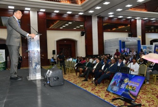 Prime Minister, Dr. the Most Hon. Andrew Holness, delivers the keynote address at the opening of Outsource2Jamaica on Thursday (April 10), at the Montego Bay Convention Centre in St. James.

