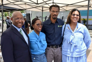 Minister of Industry, Investment and Commerce, Senator the Hon. Aubyn Hill (left), shares a photo opportunity with (from second left) General Manager, Jamaica Association of Composers Authors and Publishers (JACAP), Lydia Rose; General Manager, Jamaica Music Society (JAMMS), Evon Mullings; and Executive Director, Jamaica Intellectual Property Office (JIPO), Lilyclaire Bellamy, during JIPO’s Intellectual Property Week Mini Business Expo and Concert at Emancipation Park in St. Andrew on Friday (April 25).