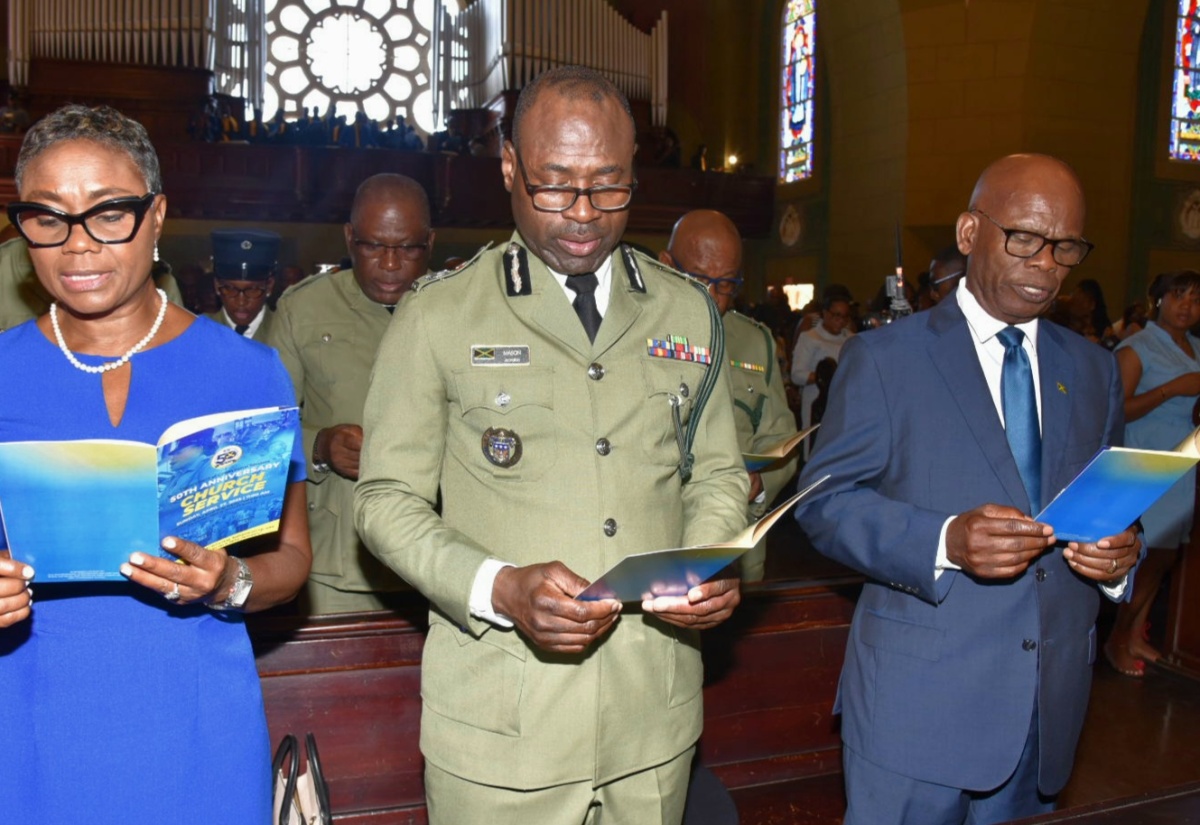 Minister of State in the Ministry of National Security, Hon. Juliet Cuthbert Flynn (left); Commissioner of Corrections, Brigadier Radgh Mason (centre); and Custos Rotulorum for Kingston, Hon. Steadman Fuller, participate in the Department of Correctional Services (DCS) 50th anniversary church service at the Cathedral of the Most Holy Trinity in downtown Kingston on Sunday (April 27).