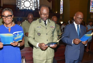 Minister of State in the Ministry of National Security, Hon. Juliet Cuthbert Flynn (left); Commissioner of Corrections, Brigadier Radgh Mason (centre); and Custos Rotulorum for Kingston, Hon. Steadman Fuller, participate in the Department of Correctional Services (DCS) 50th anniversary church service at the Cathedral of the Most Holy Trinity in downtown Kingston on Sunday (April 27).