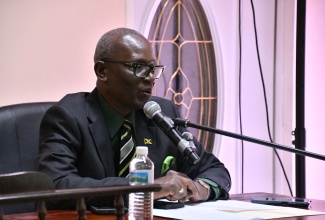 Minister of Local Government and Community Development, Hon. Desmond McKenzie, addresses the St. Elizabeth Municipal Corporation’s monthly meeting in Black River on April 10.