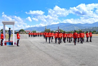 High Commissioner of India to Jamaica, His Excellency Shri Mayank Joshi (standing on dais), receives the general salute from newly commissioned Officer Cadets during the Jamaica Defence Force (JDF) Initial Officer Training Programme (IOTP) Commissioning Parade at Up Park Camp in Kingston on Thursday (April 17).