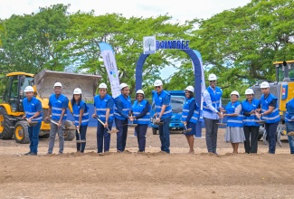 Prime Minister, Dr. the Most Andrew Holness (centre), is joined by representatives from government, the Urban Development Corporation and Asphaltic Concrete Enterprise and other stakeholders to break ground for the RainTree Commercial Complex, located just outside Kingston at Caymanas Estate, in Ferry Pen, St. Catherine, on April 16.

