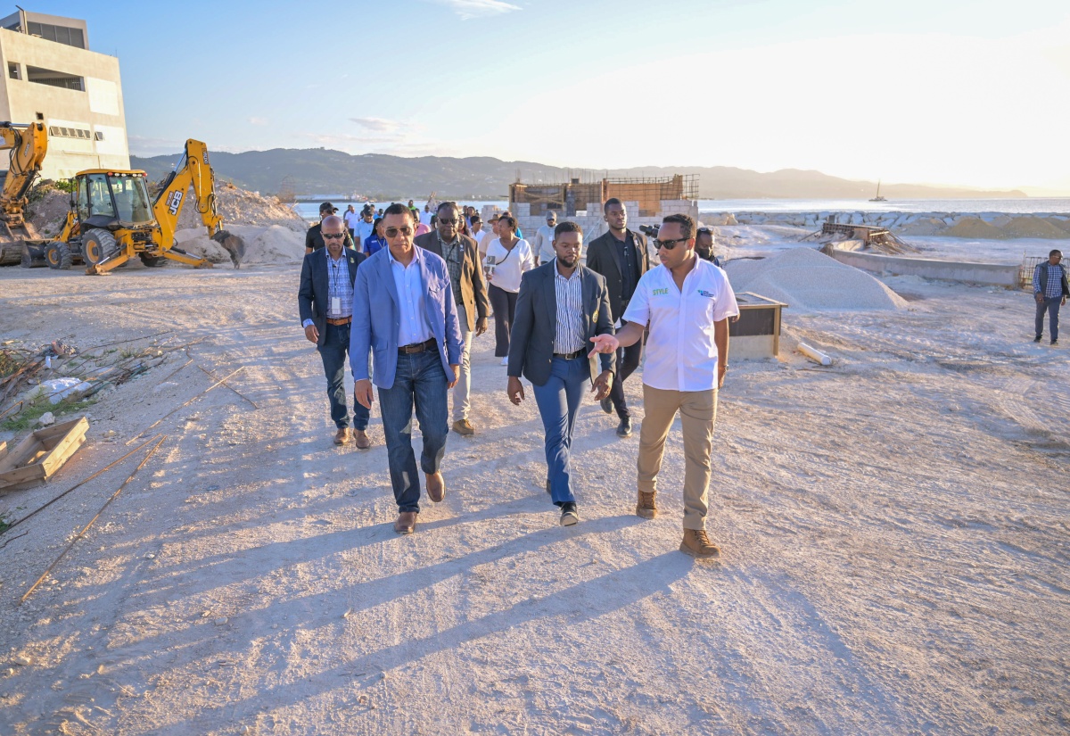 Prime Minister, Dr. the Most Hon. Andrew Holness (left), tours the Harmony Beach Park in Montego Bay, St. James on Friday (April 25). He is accompanied by Mayor of Montego Bay, Councillor Richard Vernon (centre) and General Manager of the Urban Development Corporation (UDC) L. Robert Honeyghan (right).