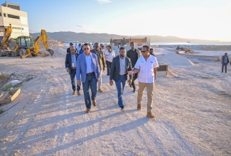 Prime Minister, Dr. the Most Hon. Andrew Holness (left), tours the Harmony Beach Park in Montego Bay, St. James on Friday (April 25). He is accompanied by Mayor of Montego Bay, Councillor Richard Vernon (centre) and General Manager of the Urban Development Corporation (UDC) L. Robert Honeyghan (right).