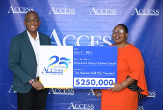 Chief Executive Officer, Access Financial Services Limited, Hugh Campbell, hands over a donation to Principal of Rose Mount Primary and Infant School, Malaika Sinclair-Bailey, during the launch of the company’s ‘Access Hope’ initiative at the entity’s headquarters in Kingston on May 21.

