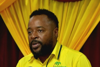 Chief Executive Officer of the Coconut Industry Board (CIB), Shaun Cameron, addresses the launch of a series of town hall meetings to commemorate the agency’s 80th anniversary, in Church Pen, St. Catherine, on May 20.