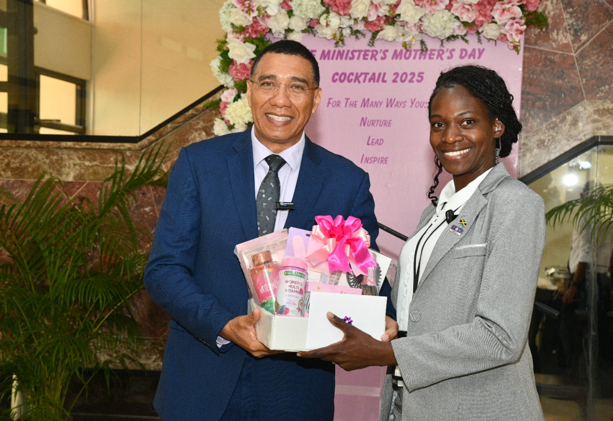 Prime Minister, Dr. the Most Hon. Andrew Holness, presents a gift basket and gift certificate to Sergeant Saralee Stephenson Davis, during a special Mother’s Day function on Thursday (May 8). The event was held at the Office of the Prime Minister. The function honoured mothers who are staff members of the Office of the Prime Minister, Jamaica House, and the Office of the Cabinet. Mother’s Day 2025 will be observed on Sunday, May 11.