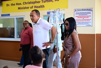 Minister of Health and Wellness, Dr. the Hon. Christopher Tufton (centre); Member of Parliament for St. Thomas Eastern, Dr. Michelle Charles, and Medical Officer of Health for St. Thomas, Dr. D
