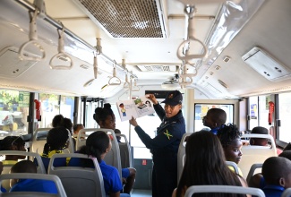 The Jamaica Constabulary Force partnered with the Jamaica Urban Transit Company (JUTC) to give students at the Yallahs Primary School an immersive experience on Read Across Jamaica Day, May 6.