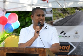 Minister of Agriculture, Fisheries and Mining, Hon. Floyd Green, delivers the main address during the official opening of the Platfield to Brainerd Farm Road in St. Mary on Wednesday (May 7).

