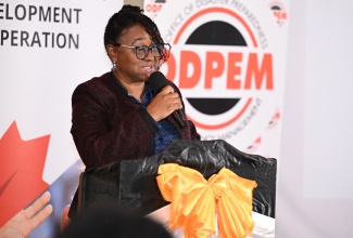 Acting Deputy Director, Office of Disaster Preparedness and Emergency Management (ODPEM), Michelle Edwards, addressing the closing ceremony for the ‘Disaster Relief Support for Women with and Affected by HIV/AIDS and Gender-based Violence in Jamaica’ project, held at 4a Hopefield Avenue in Kingston on April 30. Implemented by Eve for Life in partnership with ODPEM and Caribbean Disaster Emergency Management Agency (CDEMA), the project aimed to provide targeted, gender-sensitive relief and recovery assistance to women and families disproportionately affected by HIV/AIDS and sexual and gender-based violence. It was undertaken through funding from the Caribbean Early Recovery Fund (CERF) and Global Affairs Canada.