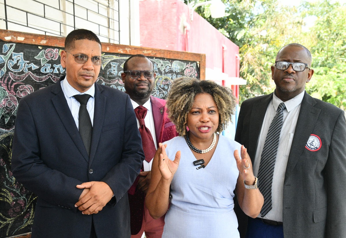 Minister of Education, Skills, Youth and Information, Senator, Dr. the Hon. Dana Morris Dixon (second right), with (from left) Member of Parliament for Central Kingston, Donovan Williams; Director of Regional Educational Services, Ministry of Education, Skills, Youth and Information, Region One (Kingston and St. Andrew), Otis Brown; and Principal of Franklyn Town Primary School, in Kingston, Rohan Trevelen. The Minister and other government officials conducted a tour of the School on Thursday (May 29).