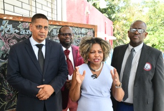 Minister of Education, Skills, Youth and Information, Senator, Dr. the Hon. Dana Morris Dixon (second right), with (from left) Member of Parliament for Central Kingston, Donovan Williams; Director of Regional Educational Services, Ministry of Education, Skills, Youth and Information, Region One (Kingston and St. Andrew), Otis Brown; and Principal of Franklyn Town Primary School, in Kingston, Rohan Trevelen. The Minister and other government officials conducted a tour of the School on Thursday (May 29).