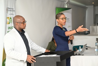Chief Executive Officer at the Jamaica Special Economic Zone Authority (JSEZA), Kelli-Dawn Hamilton (right), addresses the entity’s first Business Acceleration Centre (BAC) Accelerator Series for the 2025/2026 fiscal year at the S Hotel in Montego Bay, St. James, on Thursday, May 22. Looking on is Senior Director of Regulation, Policy, Monitoring and Enforcement at JSEZA, Ainsley Brown.

