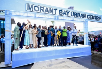 Prime Minister, Dr. the Most. Hon. Andrew Holness (eighth right), leads a ribbon-cutting exercise to signal the completion of the Morant Bay Urban Centre in St. Thomas on May 15. He is joined by Members of the Cabinet; Members of Parliament, funding partners, business leaders and others.