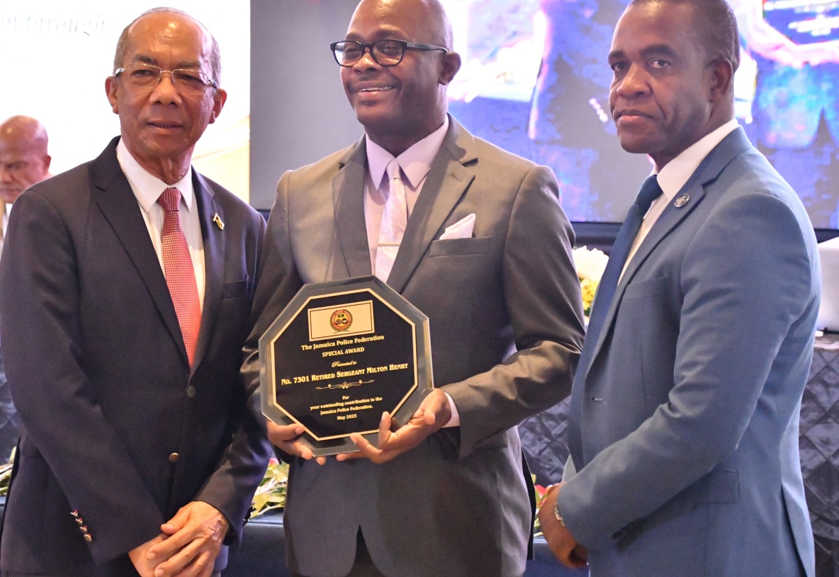 Minister of National Security, Hon. Dr. Horace Chang (left), and Commissioner of Police, Dr. Kevin Blake (right), with retired Sergeant, Milton Henry, who was given a special award by the Jamaica Police Federation at its 82nd Joint Central Conference, which was held at the Princess Grand Hotel in Hanover on Tuesday (May 27).

 