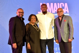 Tourism Minister, Hon. Edmund Bartlett (right); Minister of Culture, Gender, Entertainment and Sport, Hon. Olivia Grange, and Director of Tourism, Donovan White (left), with the country’s newly appointed Global Tourism Ambassador, Usain Bolt, during the Jamaica Tourist Board’s (JTB)  70th anniversary event at Devon House on May 22. 


