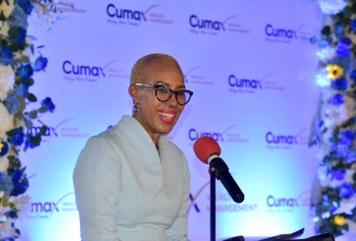 Minister of Finance and the Public Service, Hon. Fayval Williams, addresses the recent Cumax Wealth Management Spring Investment Forum at the Terra Nova All-Suite Hotel in Kingston.

