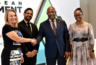 Minister of Industry, Investment and Commerce, Senator the Hon. Aubyn Hill (second right), greets Ambassador of the European Union to Jamaica, Her Excellency Dr. Erja Askola (left), during the official launch of the Caribbean Investment Forum 2025 on Tuesday (May 6), at the AC Hotel in Kingston. Sharing in the moment are Executive Director of Caribbean Export, Dr. Damie Sinanan (second left) and President of Jamaica Promotions Corporation (JAMPRO), Shullette Cox. The three-day forum will be held from July 29 to 31 at the Montego Bay Conference Centre in St. James.


