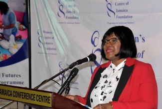 Chief Executive Officer of the National Parenting Support Commission (NPSC), Kaysia Kerr, addresses the inaugural Women’s Centre of Jamaica Foundation’s (WCJF) Empowered Futures Parenting Symposium held on Friday (May 9), at the Jamaica Conference Centre in downtown Kingston. She represented Minister of Education, Skills, Youth and Information, Senator Dr. the Hon. Dana Morris Dixon at the event.