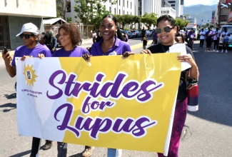 The Lupus Foundation of Jamaica team (from left), Director, Cedric McDonald; President, Desiree Tulloch-Reid and Executive Director, Tishauna Mullings, are joined by lupus warrior, Danielle Hall at the Foundation's Strides for Lupus walk held on May 10 in New Kingston. The event aimed to raise awareness about lupus and show support for persons living with the condition.

