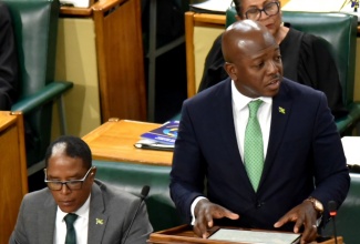 Minister of Labour and Social Security, Hon. Pearnel Charles Jr., delivers his 2025/26 Sectoral Debate presentation in the House of Representatives on Tuesday (May 13).