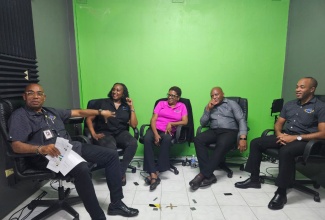The Police Civilian Oversight Authority (PCOA) Team in studio discussing JCF Public Interaction Policy with Assistant Commissioner of Police (ACP) Desmond Brooks (second right) of the Inspectorate and Professional Standards Oversight Bureau (IPROB), on Citizen Corner Podcast. Members of the team (from left) are Senior Director, Inspection and Monitoring, Andrew Beaumont; PCOA Chief Executive Officer, Otarah Byfield Nugent; Communications and PR Manager, Karen Cadien; and Legal Counsel, Sheldon Clarke.

