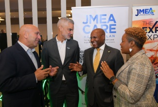 Minister of Industry, Investment and Commerce, Senator the Hon. Aubyn Hill  (second right), in discussion with (from left) President and Chief Executive Officer, Sagicor Group Jamaica Limited, Christopher Zacca; President, Jamaica Manufacturers and Exporters Association (JMEA), Sydney Thwaites and Executive Director, JMEA, Kamesha Blake, during the Jamaica Manufacturers and Exporters Association (JMEA) Manufacture 360° Conference, at the AC Marriott Hotel in St. Andrew on May 29. 

