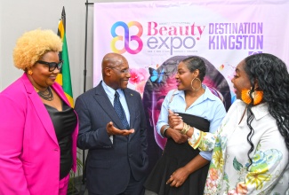 Minister of Industry, Investment and Commerce, Senator the Hon. Aubyn Hill (second left), converses with (from left) Founder/Coordinator, Jamaica International Beauty Expo, Suzette Brown; Director of the O Spot Skincare Clinic in Toronto, Canada, Orica Smart, and Lead, Canadian Delegation to the Expo, Keisha Pinto. The occasion was the media launch for the Expo’s 2025 staging on Tuesday (April 29) at the Jamaica Promotions Corporation (JAMPRO) head office in Kingston.

