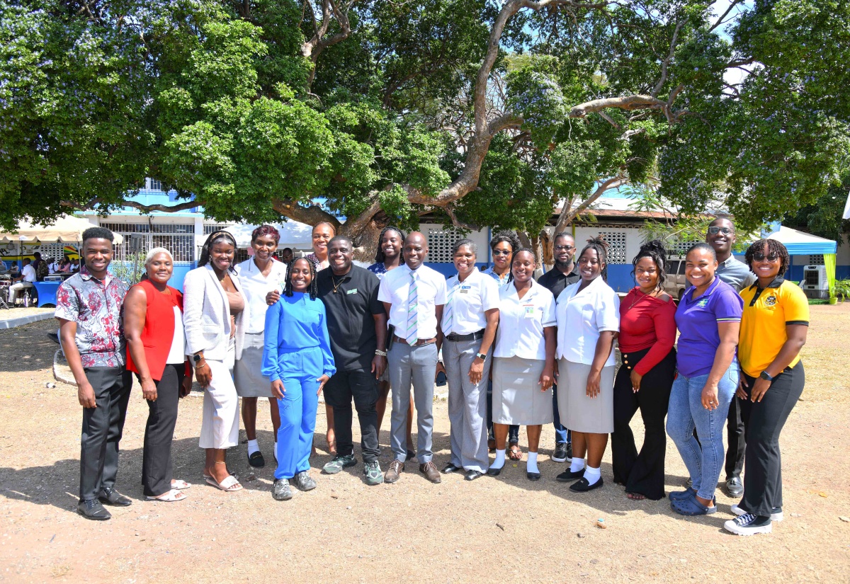 Members of the Vauxhall High School's Past Students' Association share a photo opportunity at an open day held recently at the school’s campus on Windward Road, Kingston.


