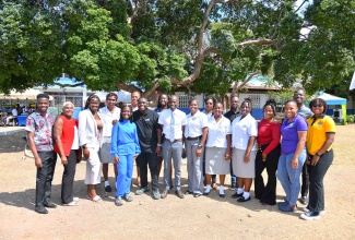 Members of the Vauxhall High School's Past Students' Association share a photo opportunity at an open day held recently at the school’s campus on Windward Road, Kingston.

