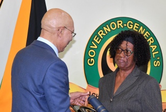 Veteran St. Ann educator Adita Sherwood (right) receives an award for her dedicated service to education from Governor-General, His Excellency the Most Hon. Sir Patrick Allen, at the Governor-General’s Achievement Awards national presentation ceremony at King’s House in July 2024.


