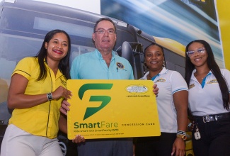Minister of Science, Energy, Telecommunications and Transport, Hon. Daryl Vaz (second left), stops at the Jamaica Urban Transit Company (JUTC) booth during a tour of the Jamaica Auto Show 2025 at the National Arena in Kingston on Saturday (May 10). He is flanked by Corporate Communications Manager, Shantole Thompson (left), Administrative Assistant Shanese Reid (second right), and Business Development Officer, Chantal Rodgers.