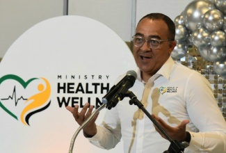Minister of Health and Wellness, Dr. the Hon. Christopher Tufton, addresses the ISO/IEC 17025 accreditation ceremony of the Environmental Health Laboratory (EHL), held on Thursday (May 1), at the AC Mariott Hotel in Kingston.