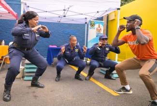 Fitness instructor and Chief Executive Officer (CEO) of W8 Aerobics, Mboya Savoury (right), leads squat exercises with Enforcement Officers from MPM Waste Management Limited (from left), Claudette Richardson, Lacivia Whyte and Joslyn Pyke, at the National Solid Waste Management Authority (NSWMA) staff health fair, held on Monday (May 5) at the agency’s Half-Way Tree Road offices in Kingston. The event was held under the theme ‘Wellness Starts Here: A Stronger, Healthier NSWMA Family’.