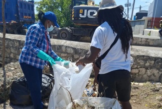 Volunteers seen here assisting with the cleaning of the main drain also known as the drag line, in Falmouth, Trelawny, on May 23.

