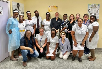 Chairman of the Issa Trust Foundation, Paul Issa (back row, centre) shares a moment with staff at the Victoria Jubilee Hospital in Kingston and overseas medical personnel during a recent health mission at the hospital in Kingston. At front left is The Foundation’s Marketing and Promotional Consultant, Sean “Contractor” Edwards

