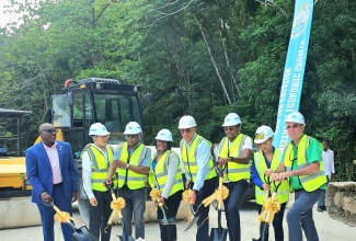Prime Minister, Dr. the Most Hon. Andrew Holness (fourth right), and Minister without Portfolio in the Ministry of Economic Growth and Job Creation with Responsibility for Works, Hon. Robert Morgan (third right), lead the symbolic breaking of ground for the Port Antonio Bypass project in Portland on June 26. 