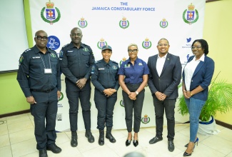 Minister of Agriculture, Fisheries and Mining, Hon. Floyd Green (second right), and State Minister in the Ministry of National Security, Hon. Juliet Cuthbert Flynn (third right), pause for a photo opportunity with (from left) Commanding Officer for the Jamaica Constabulary Force’s (JCF) Agricultural Protection Branch (APB), Senior Superintendent of Police (SSP) Oral Pascoe; Deputy Commissioner of Police (DCP) in charge of Strategic Operations, Warren Clarke; Superintendent of Police attached to the APB, Sherika Service; and Acting Director, Praedial Larceny Coordination Branch in the Ministry of Agriculture, Fisheries and Mining, Kalecia Hall. The occasion was Friday’s (June 13) launch of the APB at the JCF’s Tactical Training Academy in Kingston.