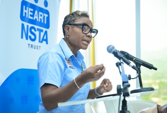 Minister of State in the Ministry of National Security, Hon. Juliet Cuthbert Flynn, addresses Friday’s (June 27) signing ceremony for a Memorandum of Understanding (MOU) formalising a partnership involving the Ministry, Department of Correctional Services (DCS), and HEART NSTA Trust to provide inmates and wards of the State with the skills and training deemed necessary to secure a meaningful employment upon release. The signing took place at the Ministry’s offices in New Kingston.