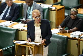 Minister of Finance and the Public Service, Hon. Fayval Williams, addresses the House of Representatives on June 17.