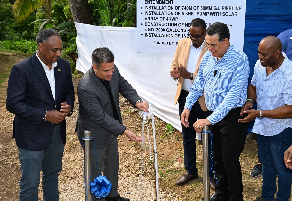 Minister without Portfolio in the Ministry of Economic Growth and Job Creation, Hon. Matthew Samuda (second left), commissions the new $23-million water supply system in the Lapland District of Catadupa, St. James, on Wednesday, June 4. He is joined by (from left) Chairman of the Rural Water Supply Limited, Omar Sweeney; Councillor for the Cambridge Division, Javin Baker; Minister of State in the Office of the Prime Minister (West), Hon. Homer Davis; and Chairman of the function, Everes Coke.

