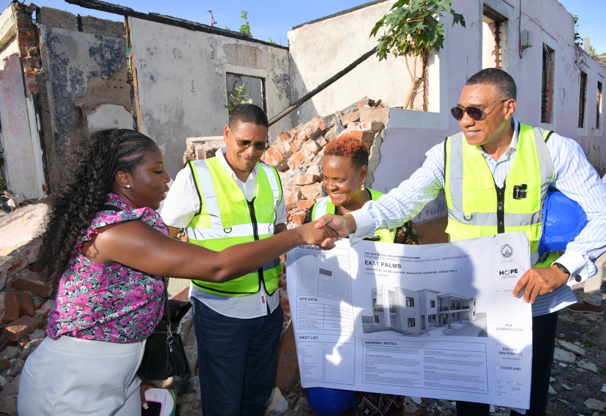 Prime Minister, Dr. the Most Hon. Andrew Holness (right), greets architect of the East Palms Housing Development in Kingston Central, Roni McLaren, during Wednesday’s (June 4) ground-breaking ceremony on East Avenue in Kingston Central. Others (from second left) are Member of Parliament, Kingston Central, Donovan Williams, and project beneficiary, representing the Palmer family, Doreen Palmer. The new development will replace the previous dwelling, which was destroyed by fire in July 2021, leaving a 13-member family homeless ever since.

