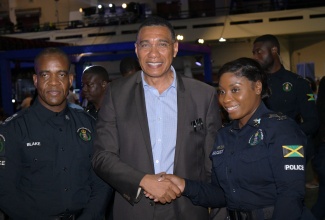 Prime Minister, Dr. the Most Hon. Andrew Holness (centre), shares a moment with Commissioner of Police, Dr. Kevin Blake (left), and Head of the Special Projects Department at the National Police College of Jamaica (NPCJ), Sergeant Shermaine Hassock (right), at the just-concluded ‘Transformations – People, Quality and Technology Expo 2.0’, at the National Arena in Kingston.


