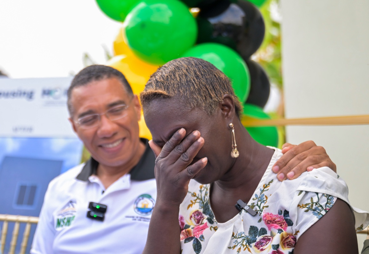 PHOTOS: PM Hands Over Houses To Two Families in Clarendon