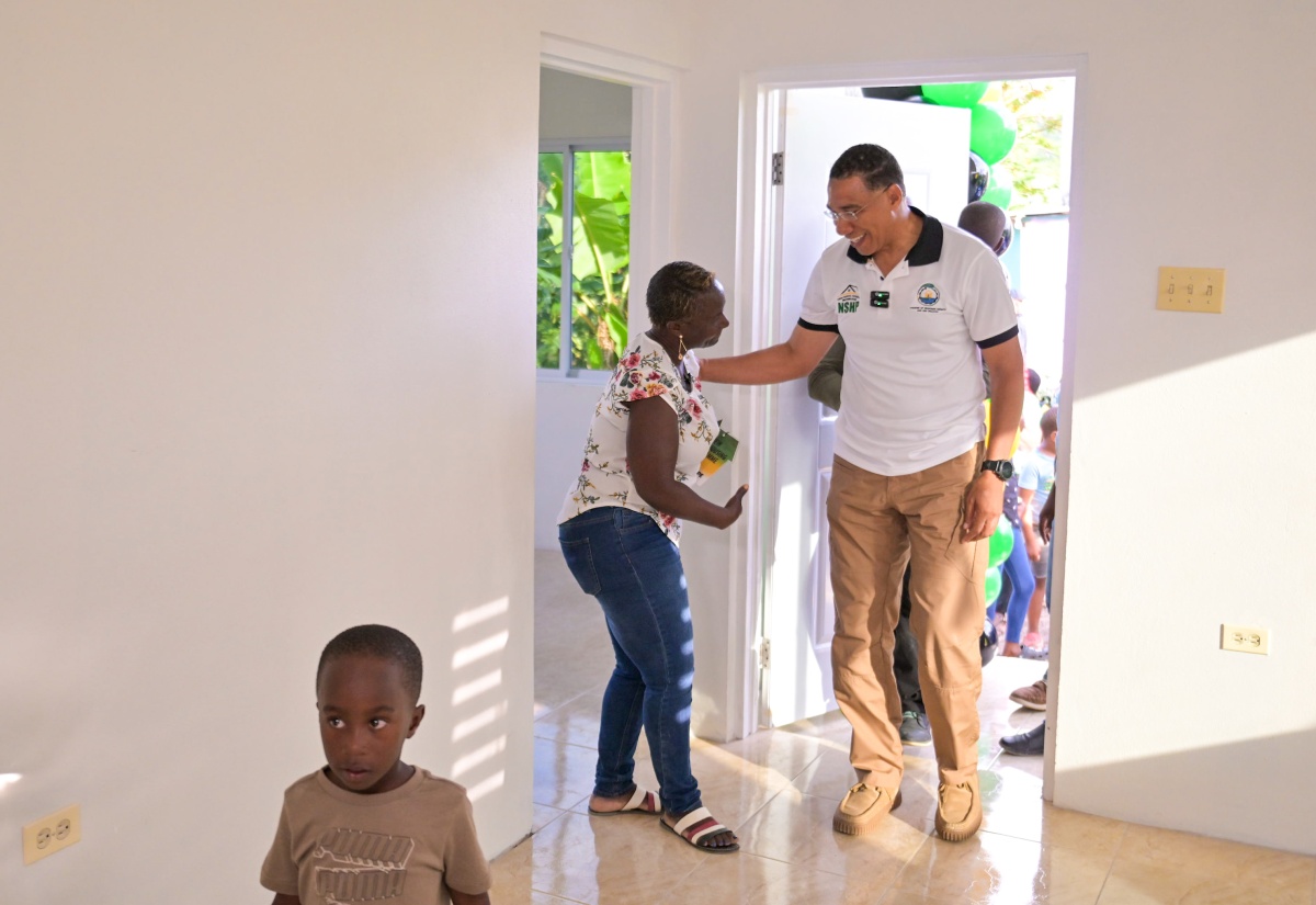 PHOTOS: PM Hands Over Houses To Two Families in Clarendon