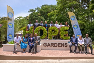 Tourism Minister, Hon. Edmund Bartlett (third left, second row), and Minister of Finance and the Public Service and Member of Parliament for St. Andrew Eastern, Hon. Fayval Williams (fourth left, back row), share a photo opportunity with participants in Tuesday’s (June 10) unveiling ceremony for the Jam-Iconic Experience at Hope Gardens in St. Andrew. From left (second row) are Executive Director, Jamaica National Heritage Trust (JNHT), Leslie Harrow; Executive Director, Tourism Enhancement Fund (TEF), Dr. Carey Wallace; Executive Director, Tourism Product Development Company (TPDCo), Wade Mars; TPDCo Board Member, Christopher Whyms-Stone; Executive Director, Nature Preservation Foundation, Carla Myrie; and Executive Director, Jamaica Vacations Limited, Joy Roberts. In the front row are (from left) TPDCo Board Member, Christopher Jarrett; Nature Preservation Foundation Board Member, Professor Carol Archer; Permanent Secretary, Ministry of Tourism, Jennifer Griffith; Chairman, Nature Preservation Foundation, Alfred Thomas; Nature Preservation Foundation Board Member, Michael McAnuff-Jones; TPDCo Board Member, Marilyn Burrowes; and Custos Rotulorum for Kingston, Hon. Steadman Fuller.

