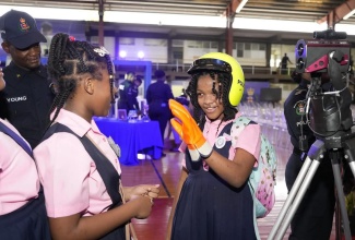 Students engage with exhibits and officers during four-day Jamaica Constabulary Force  (JCF) ‘Transformations – People, Quality and Technology Expo 2.0’, held June 19-22 at Montego Bay Community College in St. James.

